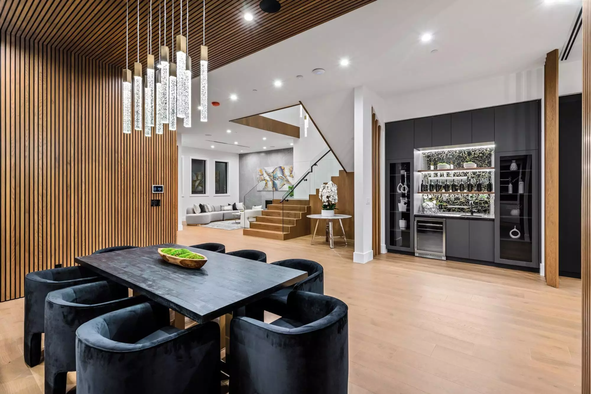 Modern dining and living area in a luxurious home interior.